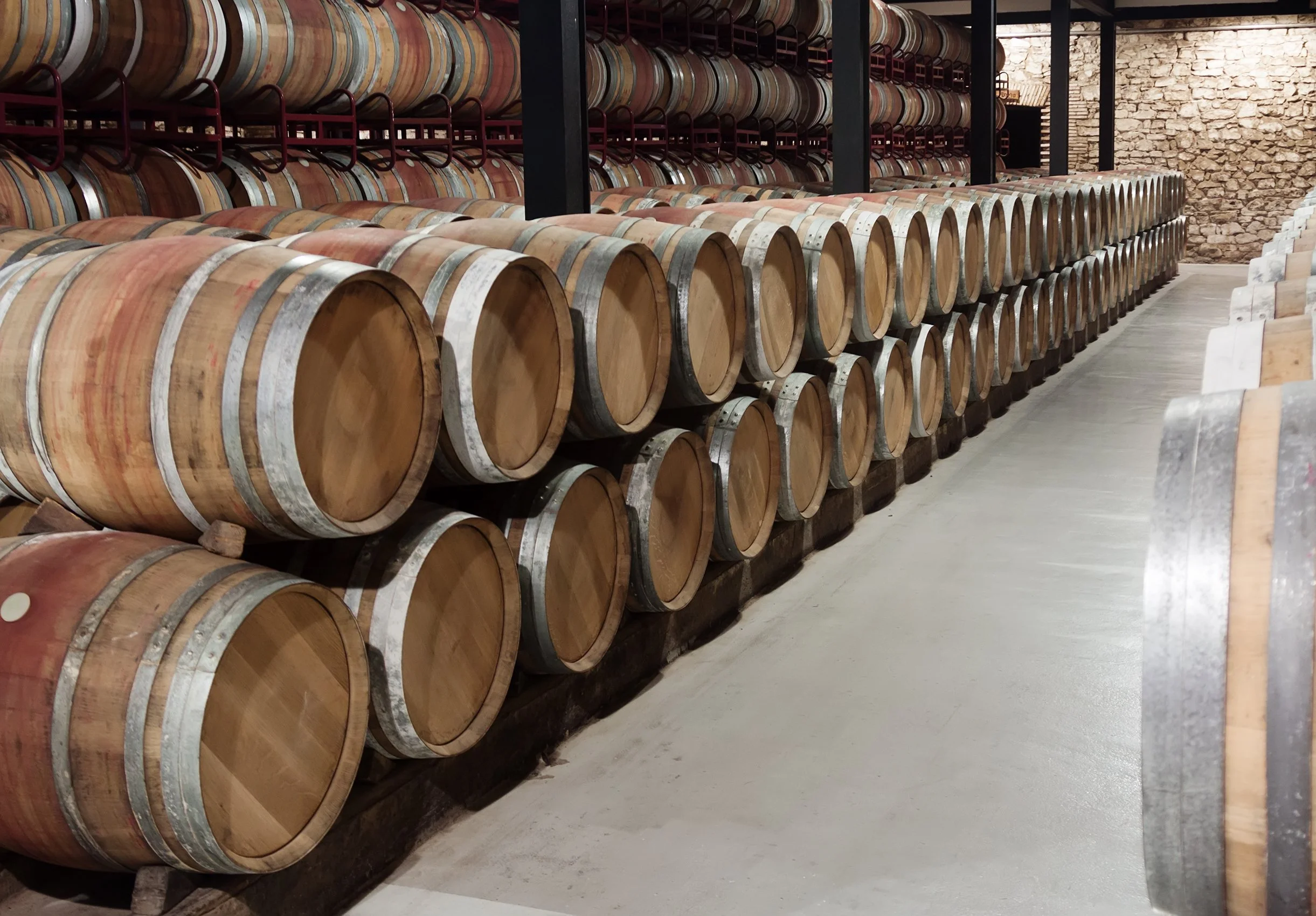 Oak wine barrels stacked in a cellar